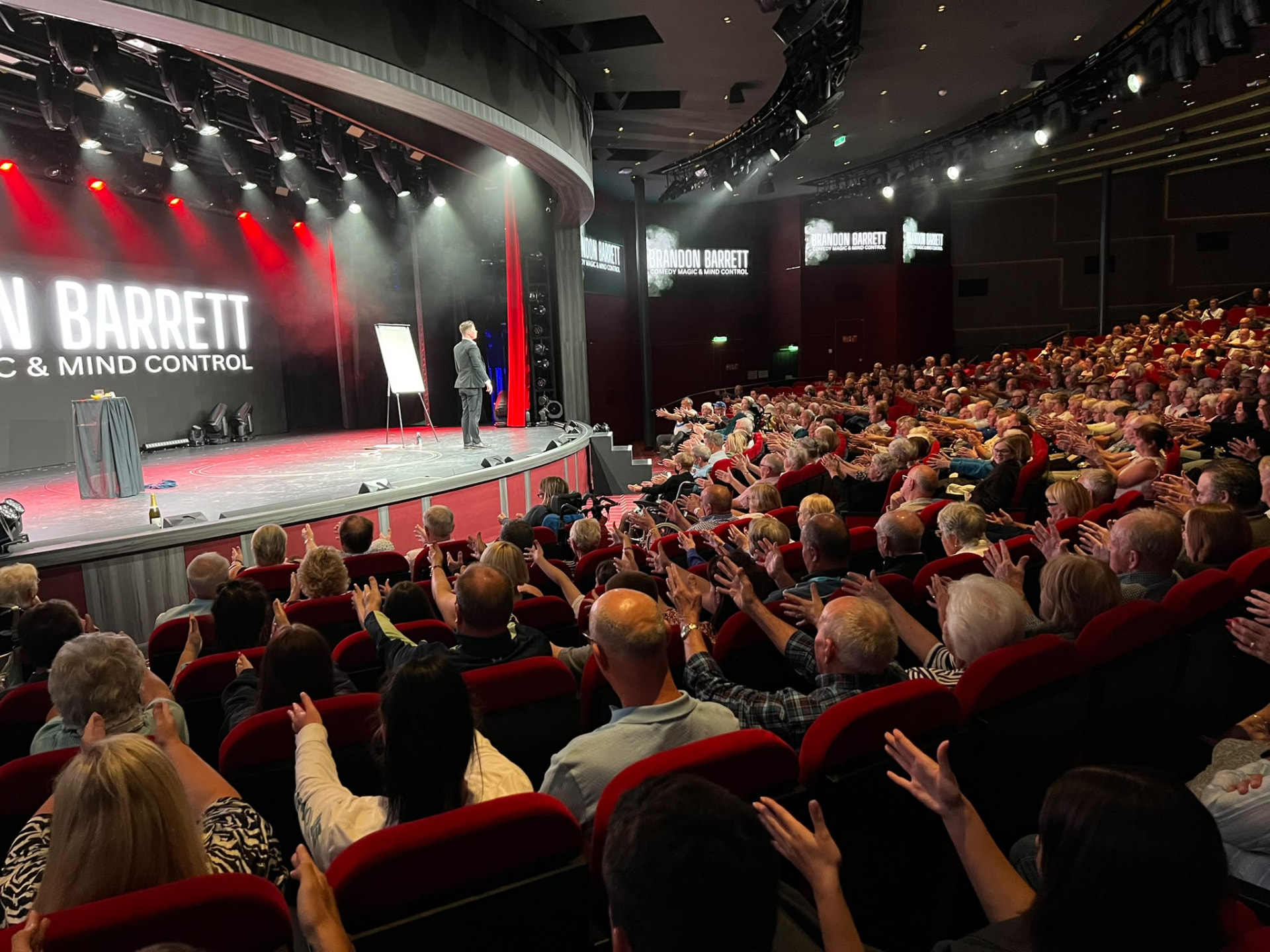 Brandon Barrett performing for a theatre audience