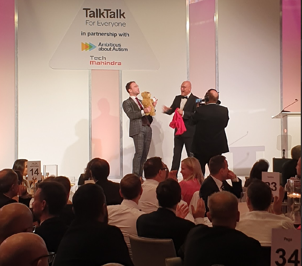Corporate guests enjoying magic at an evening event
